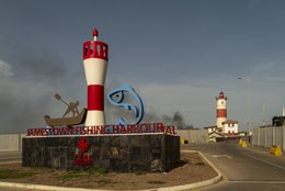 Fishing-harbour,-Signage,-Urban-sculpture,-Lighthouse,-British-colonial-architecture,-Victorian-era,-Harbour-rehabilitation,-Sino-Ghanaian-cooperation,-Smoke,-Jamestown,-Accra,-Ghana,-West-Africa